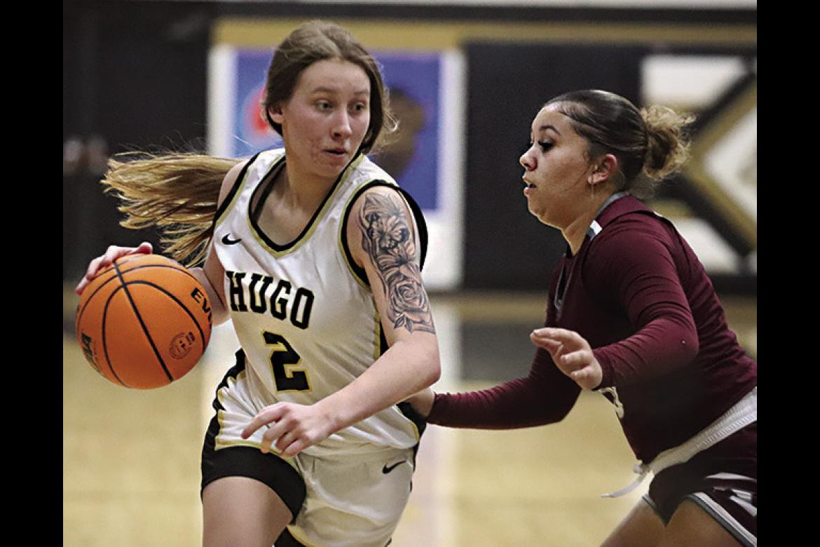 CALISTA KELLEY moves the basketball inside looking for an outlet pass during recent Hugo Lady Buffalo basketball action against Ada. Hugo News Photo / Kelli Stacy