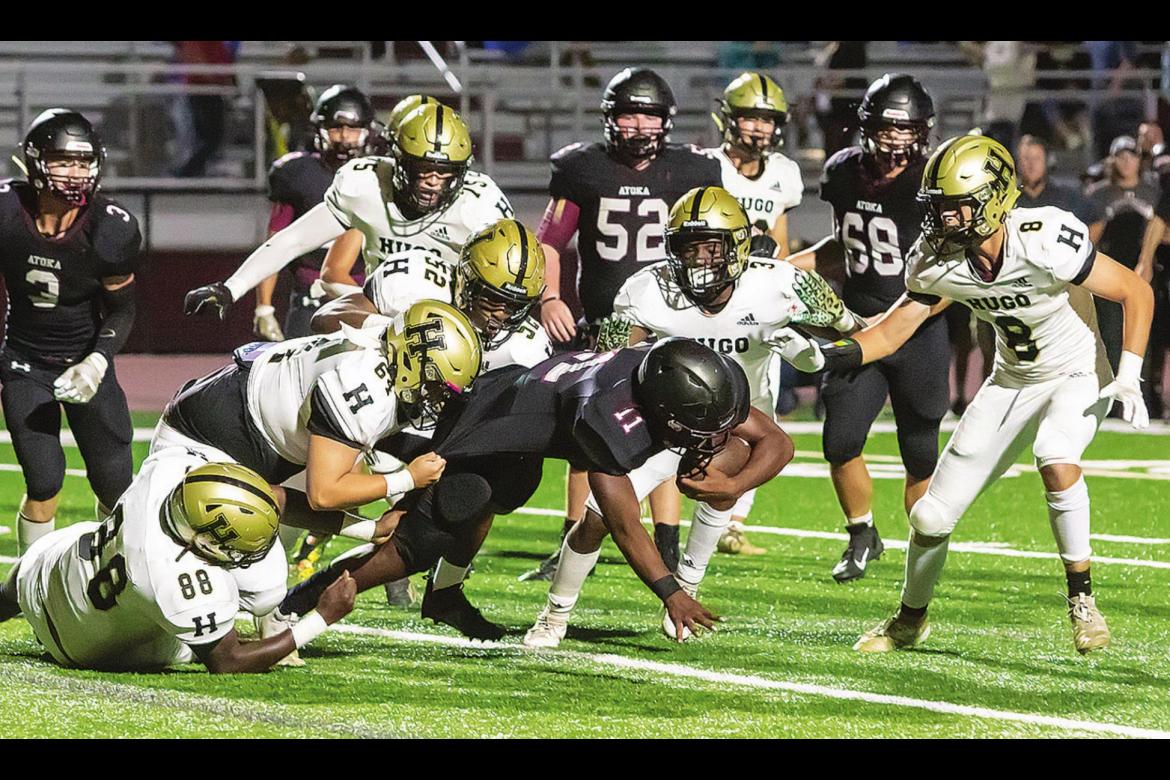 THE HUGO BUFFALO DEFENSE stepped up big time Friday in Atoka, shutting out the Wampus Cats on their home turf and giving Hugo its first District football win of the season. Above, G’Mariyon Wallace, Caleb Allen, Caleb Joe, Carlos King and Hunter Sims swarm an Atoka ball carrier for no gain. The Buffalo D will be tested on Buff Parker Field this Friday when Hugo hosts Eufaula in another District game. Hugo News Photo / Bobby Hamill