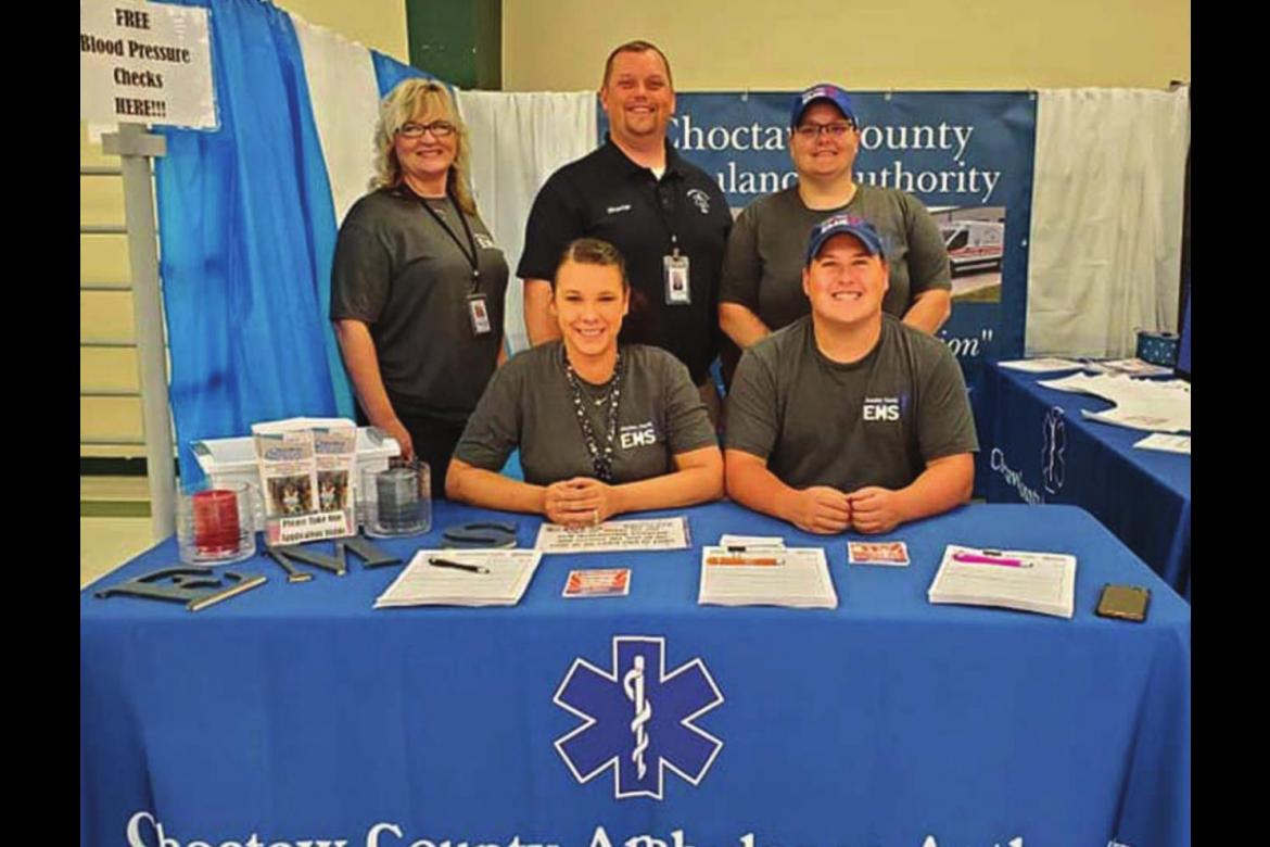CHOCTAW COUNTY Ambulance Authority Executive Director Randy Springfield (back row, center) stands by other representatives of the agency who manned a booth at the County Fair this past week.
