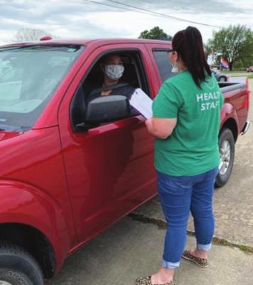 Julie McElyea, a Choctaw Nation employee, gathered resources for her coworkers at the Stigler Drive-Thru Narcan event. Photo Courtesy / CNHSA