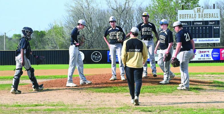 HMS COACH TANNER TRENT makes a trip out to the mound to talk a little strategy during the Hugo Middle School Monday clash against the McAlester Buffaloes. Hugo battled to a 3-2 win against their Interstate 375 rivals. Hugo News Photo / Stan Stamper