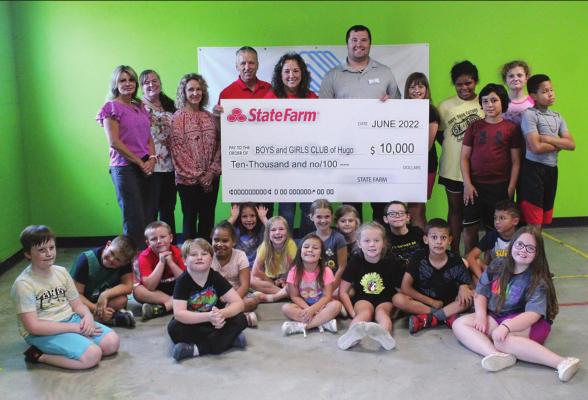 Present for the presentation was Red River Valley Boys &amp; Girls Club CEO, Kam Sallee. Joining Kevin and Rochelle Cory were local employees Trish Paliani and Rebekah Carter, along with a host of the Boys &amp; Girls Club children. Hugo News Photo / Stan Stamper
