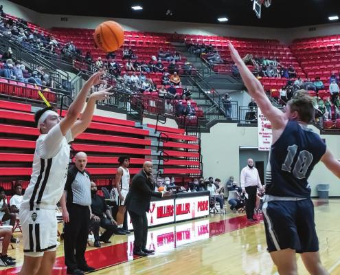 The Big Three... A.J. THOMPSON eyes the basket from the corner and lets a three-pointer fly in the Buffaloes’ quarterfinal victory over the Marlow Outlaws, as Buffalo Coach Darnell Shanklin looks on.
