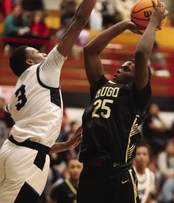MALAKHI EDWARDS puts up two points for the Hugo Buffaloes during one of their games in the Idabel Invitational last week. The Buffaloes travel to Ada this Thursday and return to Hugo Jan. 12 to open their home season here against Broken Bow. Hugo News Photo / Kelli Stacy