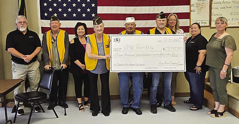 The Hugo Area Chamber of Commerce presented the local VFW with a check in the amount of $3,775 recently. The proceeds were raised during the silent auction at the annual Chamber Banquet. Pictured are: Chamber board director Tracey Stonebarger, VFW’s Wayne Herndon, chamber board director Gwen Coffman, VFW’s Elisabeth Chancellor, VFW’s Thomas Herndon III, VFW’s JK Smith, chamber president Valerie Powell and chamber board directors Lori Greer and Lena Kopp.