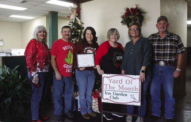 The fest ive yard of Jody Rawls was selected for Iris Garden Club’s December Yard of the Month. A variety of Christmas inflatables and hundreds of twinkly lights, set up by Kurt and Sheila Salyer, can be seen on the corner of S. Eighth St. and E. Bissell. Pictured are Holley Lowrance, Kurt and Sheila Salyer, Jody Rawls, Dusty Williams and Rick Lowrance.
