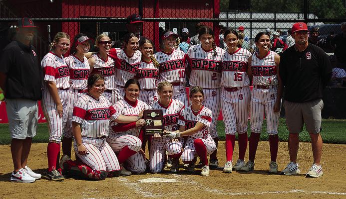 DISTRICT CHAMPIONS! All smiles after two solid District Tournament wins last week were members of the Soper Lady Red Bear Softball team. They include (back, l-r) Coach Clay Mack, Kirsten Harless, Morgan Harless, Makayla Carriger, Shyanne Wolfe, Coach Mark Hammock, Brailee Drake, Aubrey Harless, Kobi Rice, Alexis Hill, Alexa Rouse and Coach Brandon Debo, (front, Seniors, l-r) Raili Beal, Alexis Moore, Jaylee Campbell and Josie Gardner. Photo Courtesy Brian Moore