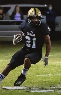 ZAN COOK turns the corner and looks for running room for the Hugo Buffalo offense in the first round of the State Playoffs in Hugo Friday against the Keys Cougars. Cook finished the game with 49 yards on 11 carries.