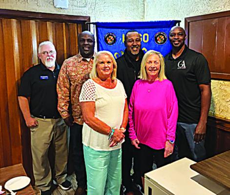 Recent speakers at the Hugo Lions Club meeting were Floyd Dixon, who will be producing an open rodeo in Hugo on July 4; and Rod Thompson, who is a former championship basketball player and college teammate of Chris Scott. They are pictured with Lions: Tracey Stonebarter, Harolynn Wofford, Susan Brewer and Chris Scott.