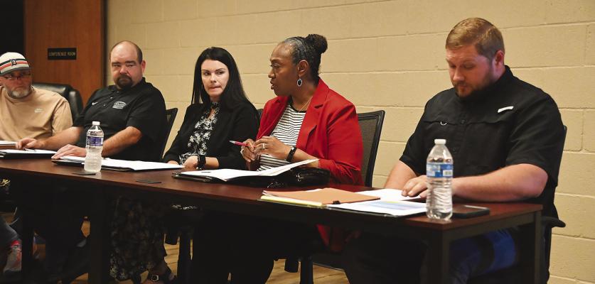 Hugo Campus princ ipals (r to l) include: Shelby Dawes (HES), Vivian Shanklin (HIS), Kendra Taylor (HMS) and Sammy Drinkard (HHS). Also pictured is board member Todd Beason.