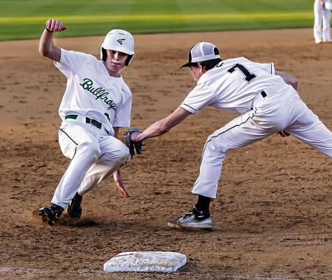 HUNTER STORY puts the tag on a Mill Creek base runner during recent baseball action on Jo Miller Field. The Tigers took the win, 3-0. HUGO NEWS PHOTO / Bobby Hamill