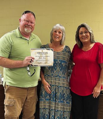 Donn a King-Sims, 21 years in the Police Dept. Pictured with John Mitchell and Tina Bunn.