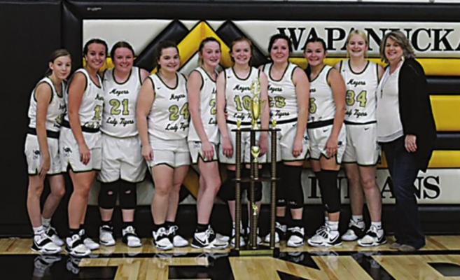 MOYERS CHAMPIONS! — Taking home the Championship Trophy from the Wapanucka Invitational Basketball Tournament this past weekend were the Moyers Lady Tigers. Members of the team pictured above (Coached by Donna Dudley) include (l-r): Kynley Lucas, Audrey Childress, Olivia Napier, Katelyn Thomas, Abby Higginbottom, Brooklyn Higginbottom, Rebecca Napier, KyeAreha Williams, and Jill Nored. (Photo Contributed.)