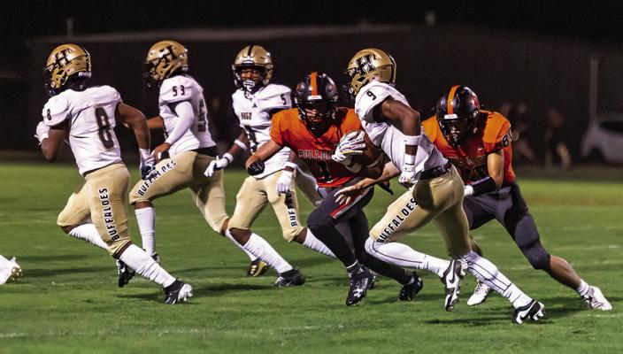 QUINCY SHELTON puts a move on two Valliant defenders who slipped underneath Hugo’s defensive coverage, as his teammates Ja’Mari Scroggins, Robbie Bautista and Dakerrious Wilson look for blocking opportunities. The Buffaloes are idle this Friday, but open their home season in Hugo on Sept. 20 against Dickson.