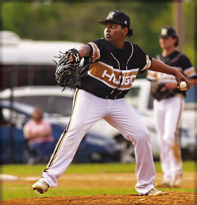 HUGO BUFFALO hurler D.K. Wilson steps to home plate to deliver a pitch during recent baseball action at home on Shull-Bywaters Field. HUGO NEWS PHOTO / Bobby Hamill