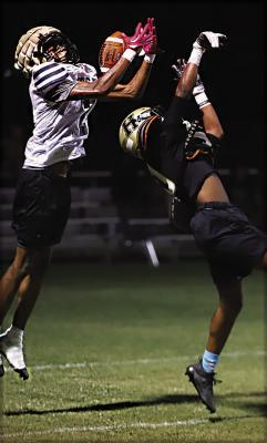 QUINCY SHELTON, a sophomore for the Hugo Buffaloes reaches over a defender to make a big play during the Buffaloes’ midnight scrimmage last week. The Buffaloes will open their 2023 football season at home on Aug. 25 against Dickson with a 7:30 p.m. kickoff. Hugo News Photo / Kelli Stacy