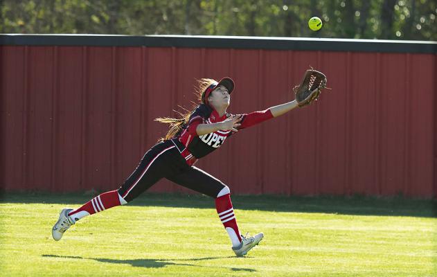 BELOW... ALEXIA ROUSE stretches to pull down a hard-hit fly ball to her outfield position for the Soper Lady Bears as they battled Stratford on their home field last week.