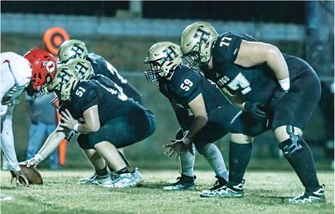 HUGO BUFFALO LINEMEN battling in the trenches for the offense this season include center Jayse Trantham (soph.), left guard Jonathan Chavez (soph.), and left tackle Connor Frazier (junior). The Buffaloes rushed the ball 31 times for 155 yards on the ground against the Warriors. Hugo News Photo / Bobby Hamill