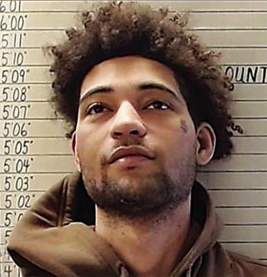 Man arrested on firearm complaints after trespassing