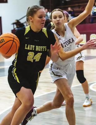 BRINLEE ALLENSWORTH pushes the basketball into the paint and draws a foul for the Hugo Lady Buffaloes in their Regional Tournament game against the Atoka Wampus Cats.