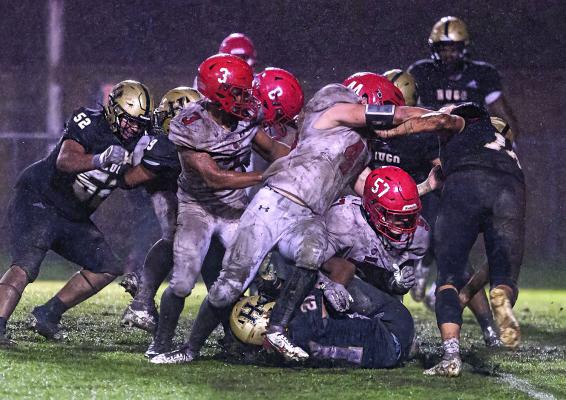 THE BUFFALOES OF 2024... Hugo News Photographer Bobby Hamill captured the essense of an intense overtime football game between two teams with a lot of heart last Friday in a true mudfest on Buff Parker Field. Above, Hugo’s Dacorion Cook runs for a Buffalo gain while several of his teammates, including Darius Woodard and Jonathan Chavez follow through with blocks. The Buffs will be hoping for a dry field Friday in the first round of the State Playoffs at Chandler. Hugo News Photo / Bobby Hamill