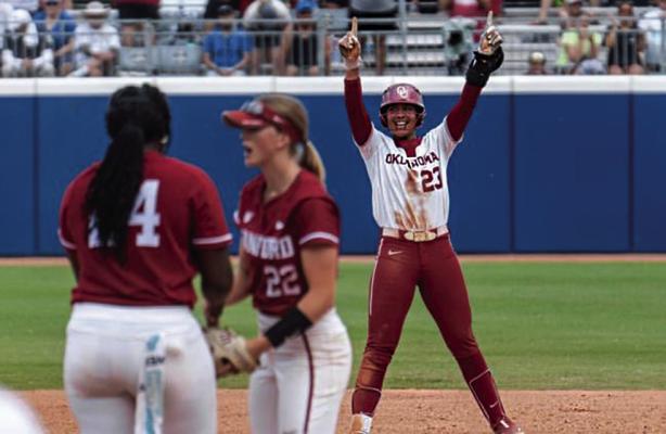 OU SLUGGER TIARE JENNINGS celebrates her late double against a very tough Stanford team to extend the Sooners’ D-1 record winning streak and advance to the WCWS Finals Wednesday in Oklahoma City against Florida State.