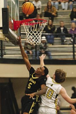 BUFFALO RETURNING STARTER QUINCY SHELTON puts up two points for the Hugo Buffaloes against the Broken Bow Savages last week. Shelton led the team with 16 points. Hugo News Photo / Kelli Stacy