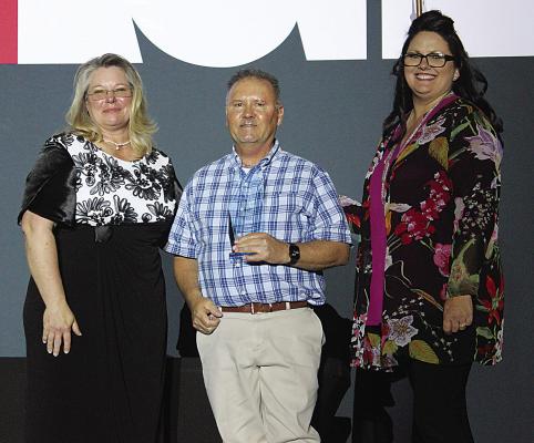 Will Smith was awarded Hugo Area Chamber of Commerce Citizen of the Year during last Thursday’s annual Chamber Banquet. The award was presented by Arlinda Darst of the Public Service Company of Oklahoma. Also pictured is Chamber representative Lena Kopp. See today’s page 2 for more award winners.
