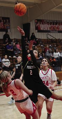 Hailey McClure shoots for Lady Tigers.