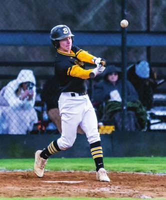 JESSE GARDNER puts the bat on the baseball during the Boswell Scorpions against the Fort Towson Tigers during recent baseball action between the two rivals.