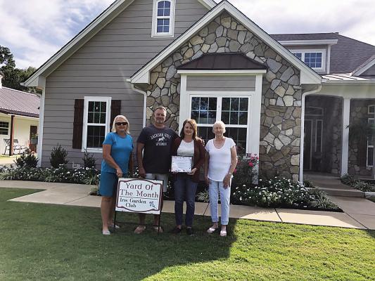 Iris Garden Club Yard of the Month belongs to Victor and Amy Caraway on Country Club Drive. The beautiful property is well maintained and features trees, shrubs, flowers and fall decorations. Pictured with the Caraways are Harolynn Wofford and Donna Colgin. Photo Courtesy / Sammye Thacker