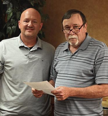 Local businessman David Dyer (left) took the Oath of Office last week to fulfill his position on the Choctaw Memorial Hospital board of directors. Administering that oath is longtime board member and president Tommy Butler (right). The hospital board meets each month at noon.