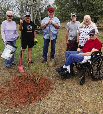 As one of the yearly projects, the Iris Garden Club of Hugo planted a crepe Myrtle tree at Elmbrooke nursing home. Pictured are residents and garden club members: Sammye Thacker, Harolynn Wofford and Rick Lowrance.