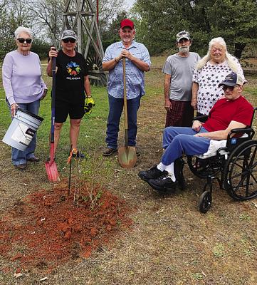 As one of the yearly projects, the Iris Garden Club of Hugo planted a crepe Myrtle tree at Elmbrooke nursing home. Pictured are residents and garden club members: Sammye Thacker, Harolynn Wofford and Rick Lowrance.