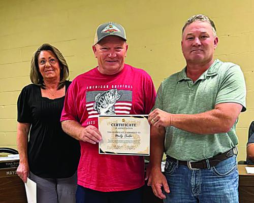 The city of Hugo celebrated the September anniversaries of two exceptional employees. Marty Clinton, Park and Recreation Supervisor, has served the city for 15 years. Also being recognized was Tyler Plemons (not pictured), a firefighter with three years of service. Pictured with Clinton are Mayor Tina Bunn and Interim City Manager Alan Renolds.