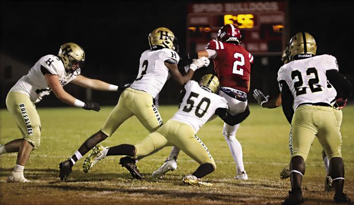ISAIAH GREER breaks into the Spiro backfield to snare their running back for a loss, as teammates Malakhai Edwards, DaShon Sims and Ethan Sparks close in to assist. The Buffaloes had a total of 88 tackles for the night against Spiro Hugo News Photo / Kelli Stacy