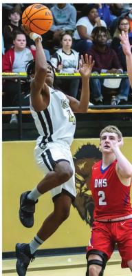 KEION JOHNSON sails into the paint to put up two points for the Hugo Buffaloes in their big win against the Durant Lions.