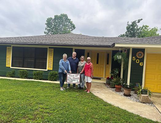 Iris Garden Club Yard of the Month was awarded to Tom and Nancy Kinney at 506 S. Third. They have done an amazing transformation on this home, along with the yard that features roses, crepe myrtles and shrubs, along with potted flowers.