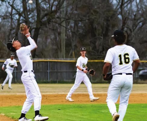 BUFFALO SHORTSTOP NICK PARISH calls for the infield fly and moves under the ball to make the play as third-baseman Aden Parish hustles in to back him up. (Hugo News Photo / Bobby Hamill)