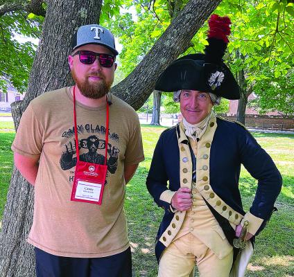 Boswell Public Schools teacher Casey Hitchcock, left, visits with a character interpreter during his visit to the 2024 Colonial Williamsburg Teacher Institute. Photo provided.