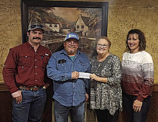 Kiamichi Conservation District presented a check on Feb. 15 for $29,186.69 to Jim Bob Sullivan, Choctaw County District 1 Commissioner, for an unpaved road project sponsored by the Oklahoma Conservation Commission. Pictured are John McQuaig, Sullivan, Lisa Payne and Kylee Edge.