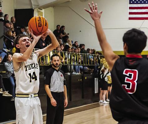 JESSE! JESSE! JESSE! — Fort Towson fans put a big cheer on when Jesse Grimes knocked down a big three-pointer last week in the Tigers’ big 61-16 win over Victory Life. Hugo News Photo / Bobby Hamill