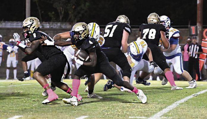 D’AIRREON JEFFRIES follows his downfield blocker Ja’Mari Scroggins as they cut through the Bethel Wildcat defense for a nice gain for the Hugo Buffalo offense. Also sealing off their blocks are Buffalo offensive linemen Jayse Trantham and Keyshawn Miller. Hugo News Photo / Stan Stamper