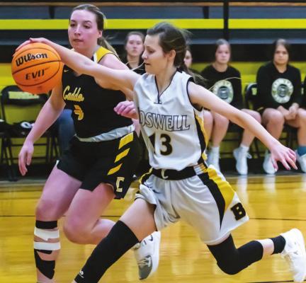 MIAH VanDUREN hustles to gain possession of a loose ball for the Boswell Lady Scorpions during their recent clash with the Lady Bruins of Caddo. The Lady Bruins had too much offense going this trip and posted an impressive 64-30 win at Boswell. Hugo News Photo / By Bobby Hamill