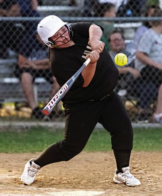 IZZY BIGFEATHER leans into a pitch for the Hugo Lady Buffaloes during a recent game in Hugo against the Antlers Lady Cats. The Lady Cats had it all going their way enroute to a 31-1 victory Hugo News Photo / Bobby Hamill