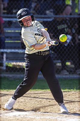 AIYONNA STOTTS rips into a pitch for a big hit for the Hugo Middle School Buffaloes during recent softball action in Hugo against the Antlers Bearcats. Hugo News Photo / Bobby Hamill