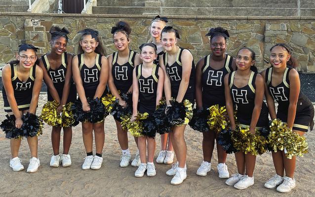 Cheering on the Hugo Middle School football team this year, are middle school cheerleaders (l to r): Liara Quina-Pintado, A’Laiya Beasley, Zinnia Johnston-Mims, La’Kaci Booker, Kieren Salyer, Pearl Garrett, Alli Harwood, D’Andria Black, Lamya Hickson and Madison Hickson.