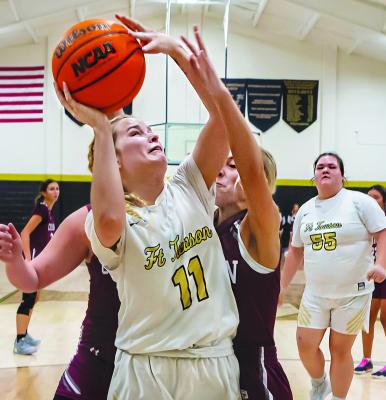 MACKENZIE WYATT battles in the paint for two points for the Lady Tigers in their 41-24 win over the Lady Wildcats. Hugo News Photo / Bobby Hamill
