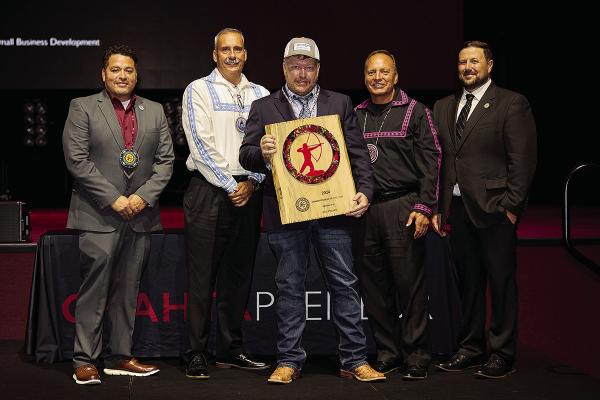 Choctaw Nation Small Business Development Manager Gary Johnson, Choctaw Nation Assistant Chief Jack Austin Jr., Choctaw Nation Chief Gary Batton and Choctaw Nation Small Business Development Director Billy Hamilton present Kyle Fincher of Southeastern Recycling with the Chahtapreneur of the Year Award.