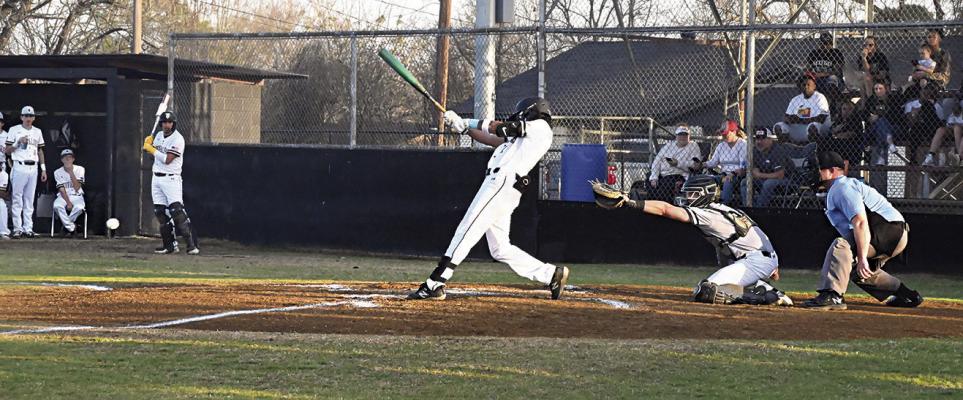 MALIKI GILLEAN strokes one of two hits he turned in for the Hugo Buffaloes in their game against last year’s State Champion Wright City Lumberjax team Friday. Gillean was the only Buffalo to record hits in the game. Hugo News Photo / Stan Stamper